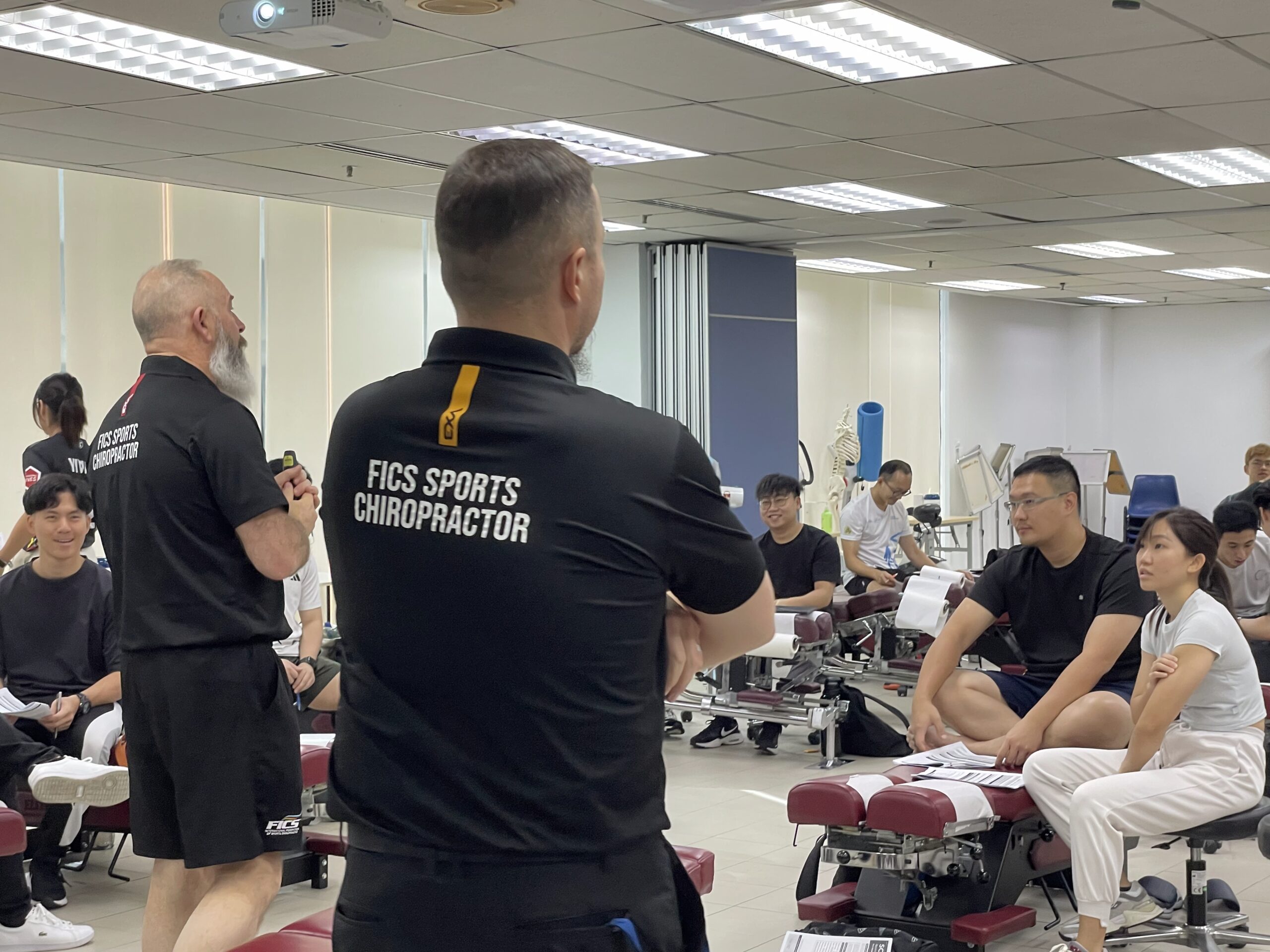 FICS sports chiropractic educators sharing knowledge with students